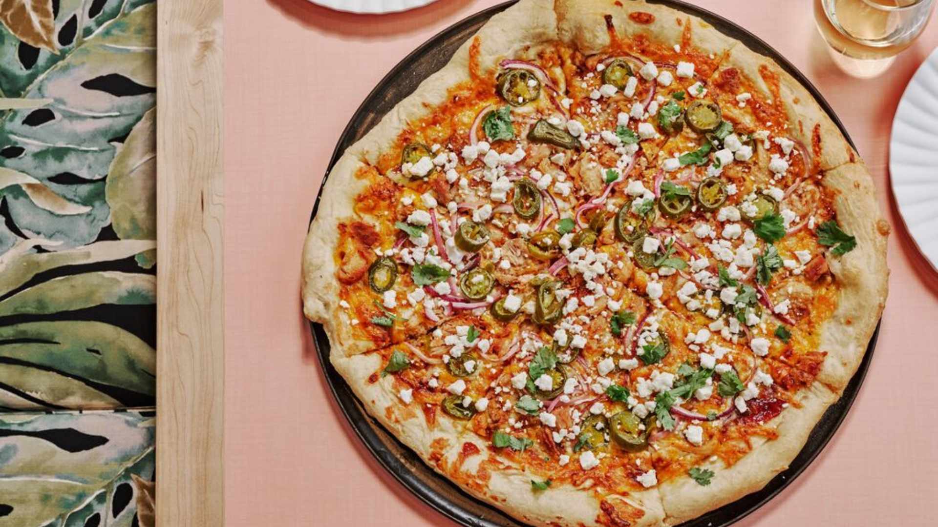 The Bandit pizza with sliced jalapeños, red onions, and crumbled feta cheese at Flipside Pizza.